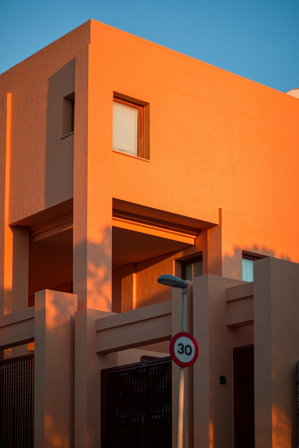 a building with a street sign in front of it