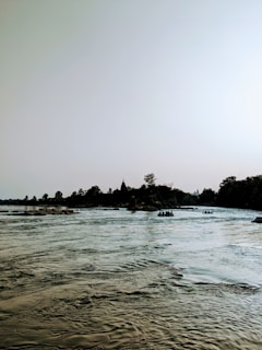 a body of water with boats floating on top of it