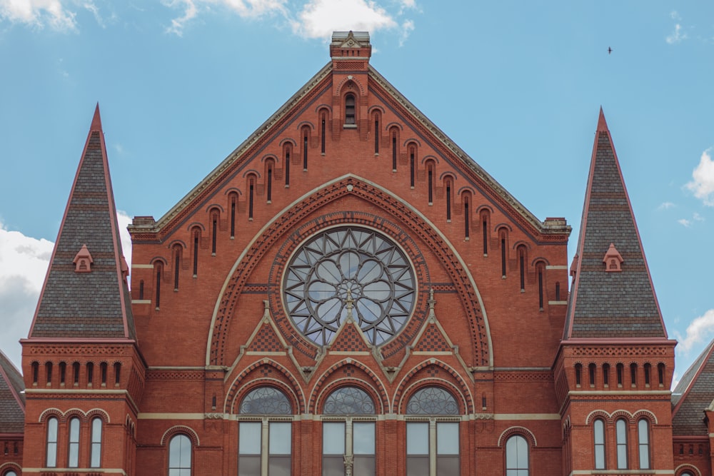 a large red brick church with a clock tower