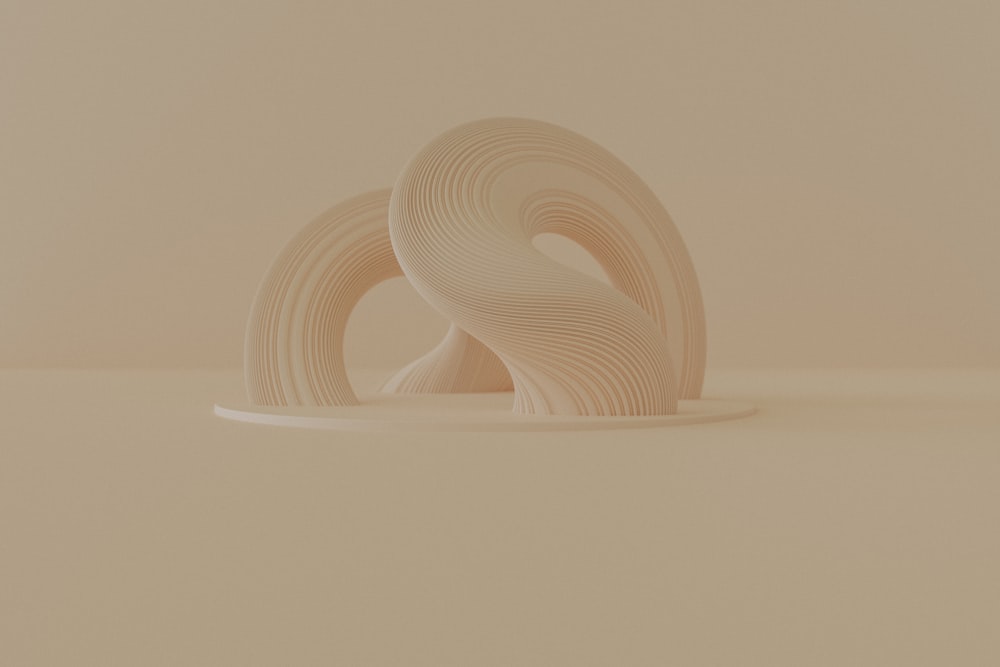a sculpture made out of white paper sitting on top of a table