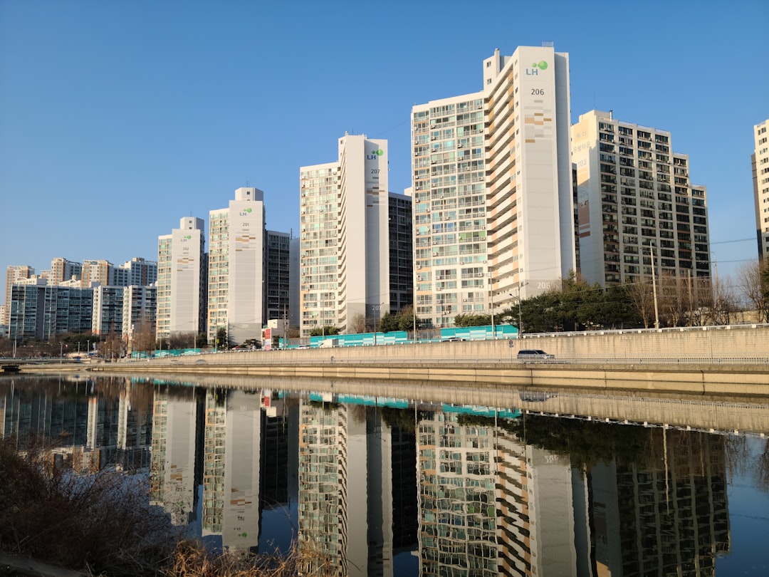 a body of water surrounded by tall buildings,