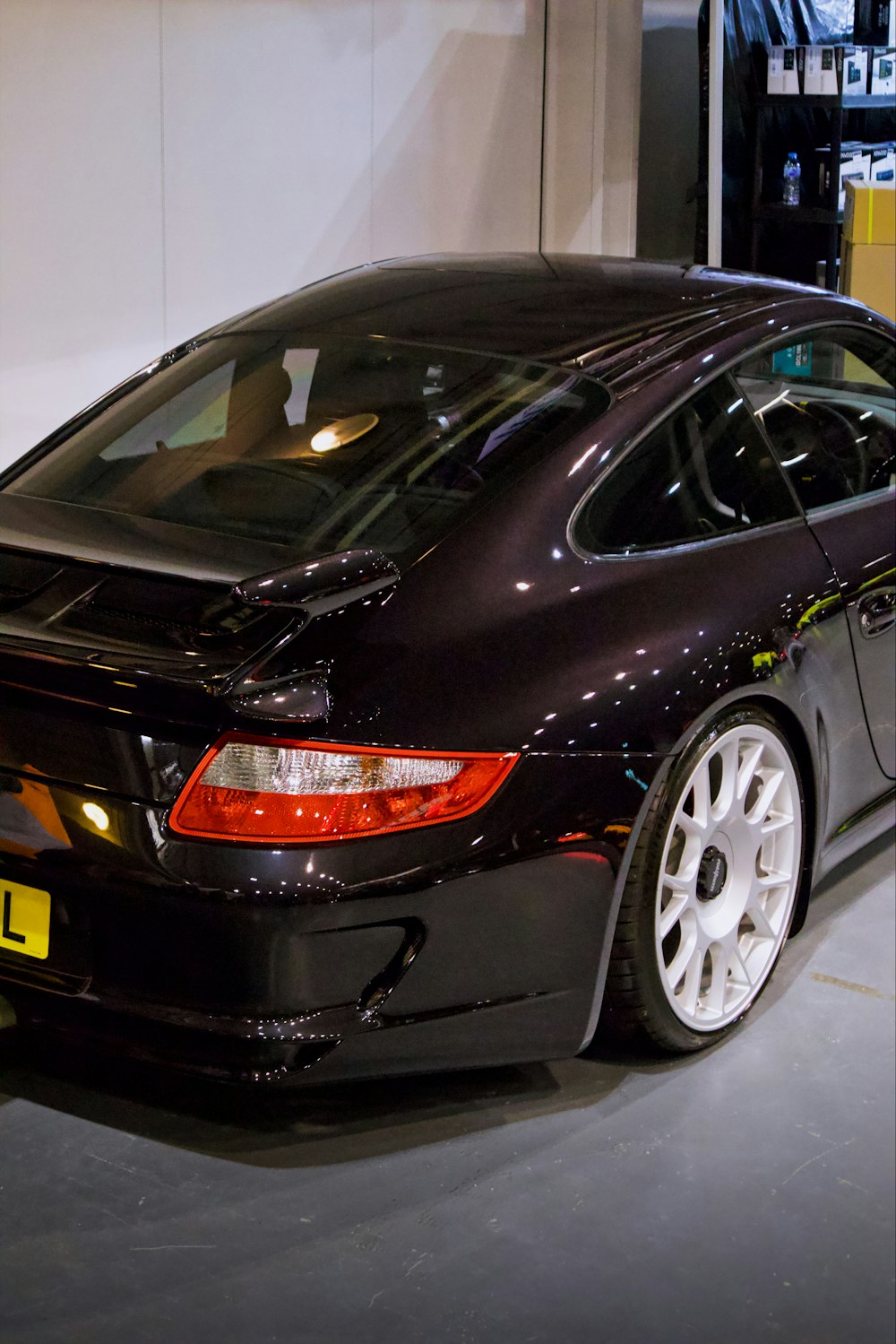 a black sports car parked in a garage