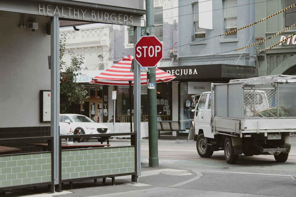 a stop sign on the corner of a city street