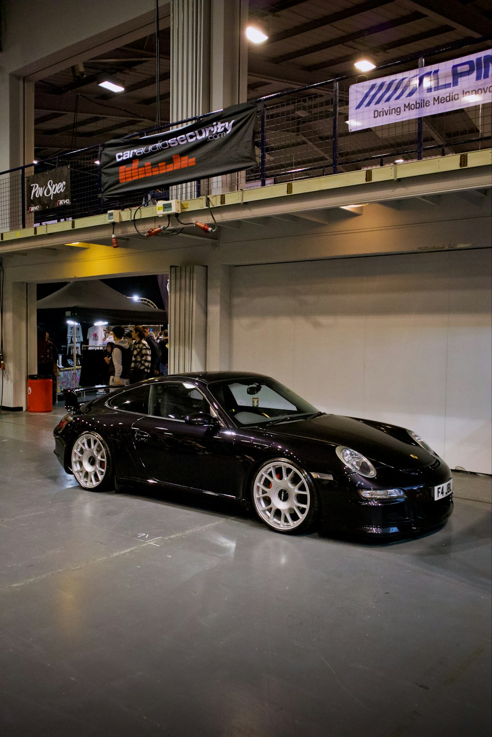 a black sports car parked in a garage