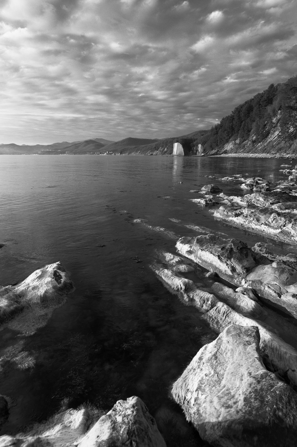 a large body of water surrounded by rocks