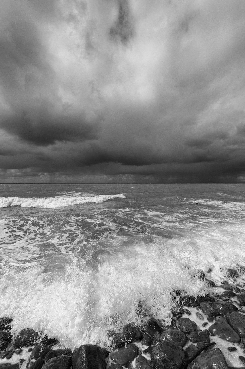 a black and white photo of the ocean