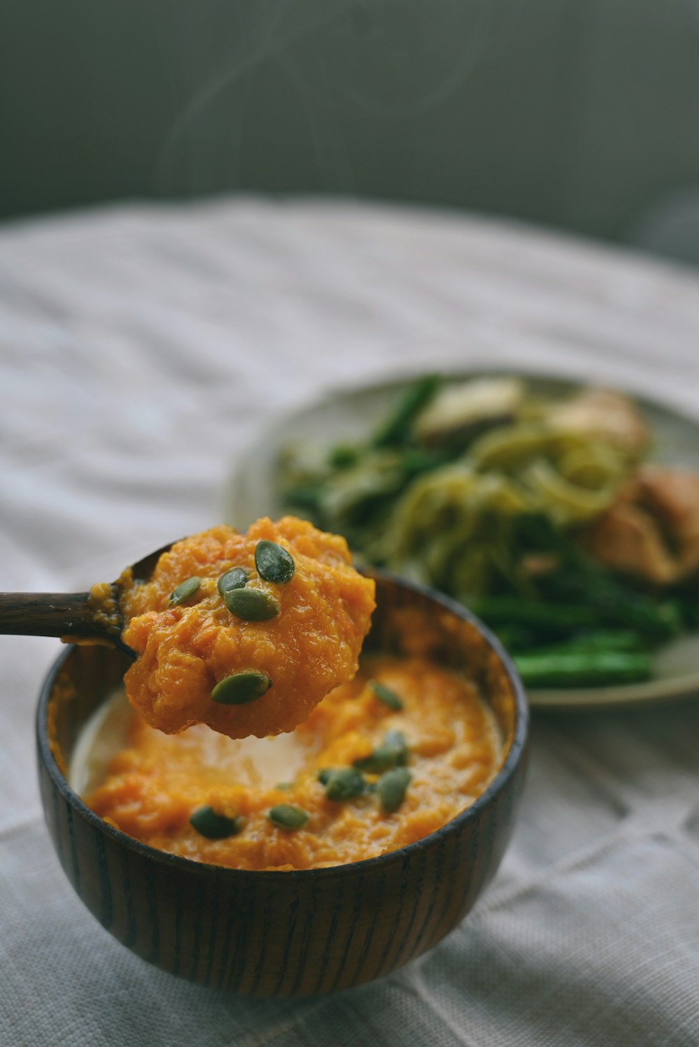 a bowl of food with a spoon in it