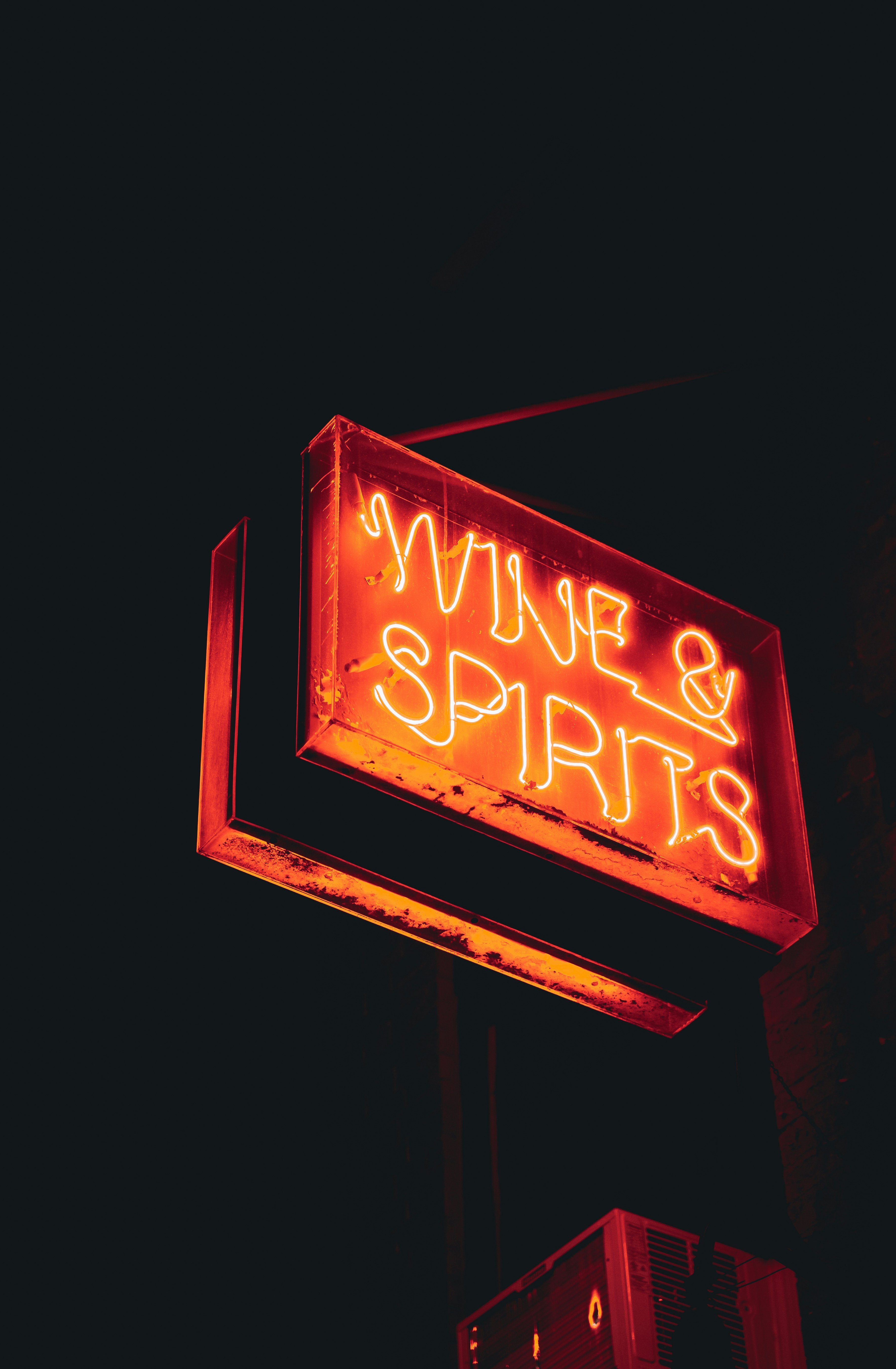 a sign lit up at night