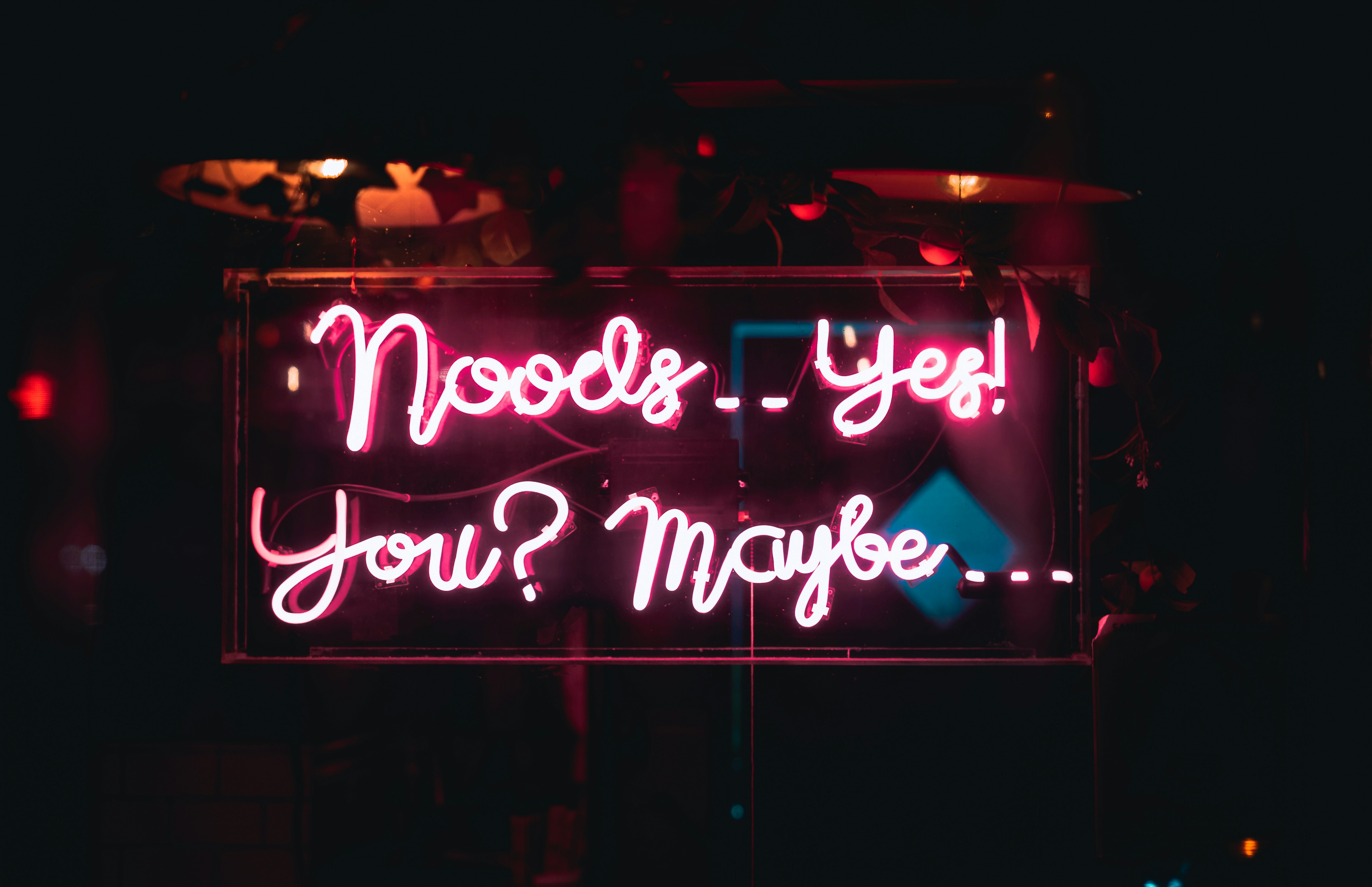 a neon sign that says, needs yee, you're maybe