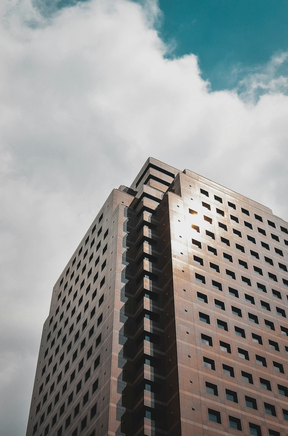 a tall building with a sky background