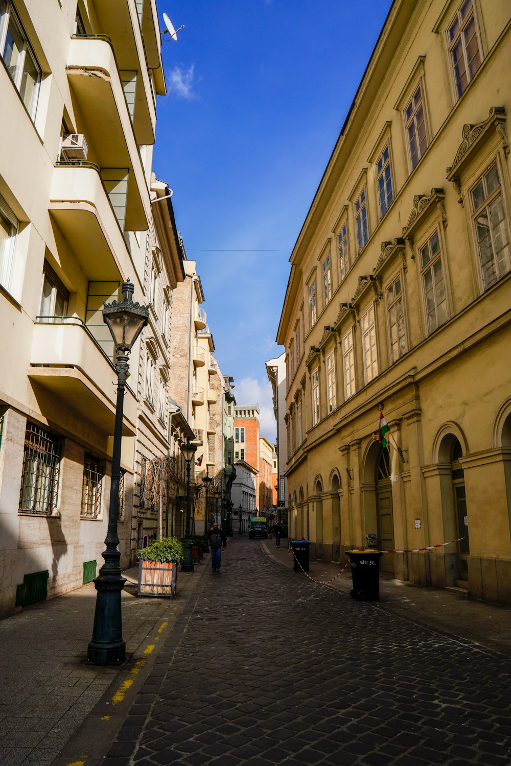 a city street with buildings and a lamp post