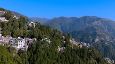 a view of a town nestled on a mountain side