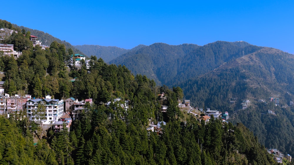 a view of a town nestled on a mountain side