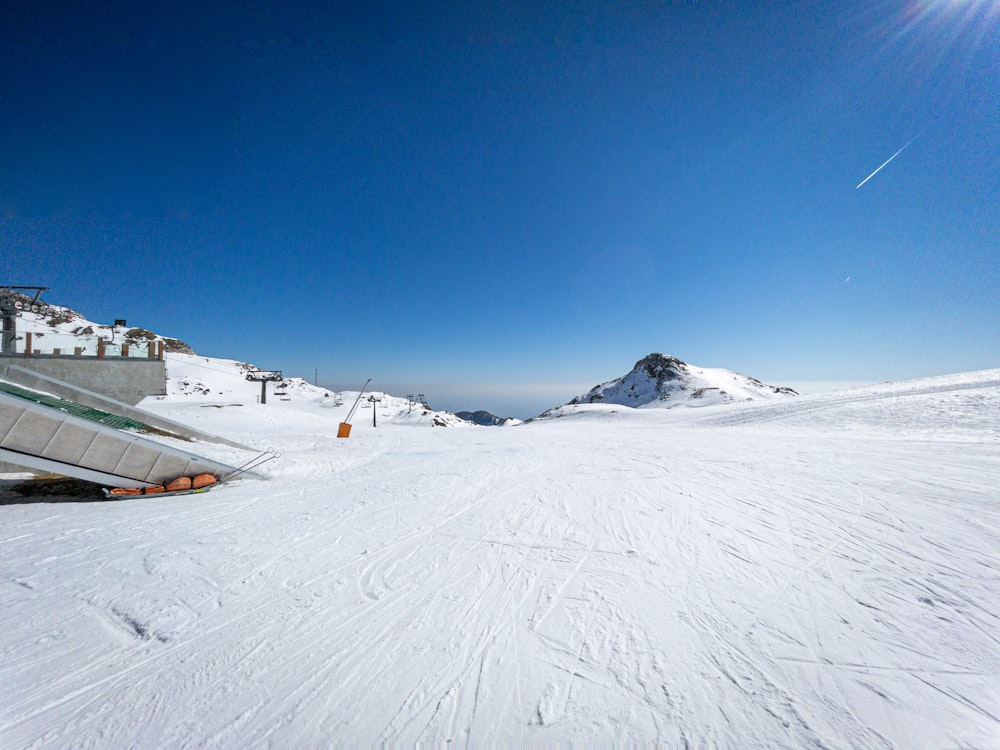 a person riding skis on a snowy surface