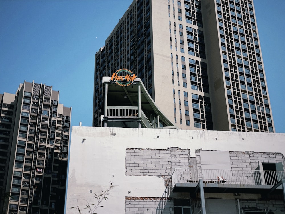 a tall building with a sign on top of it