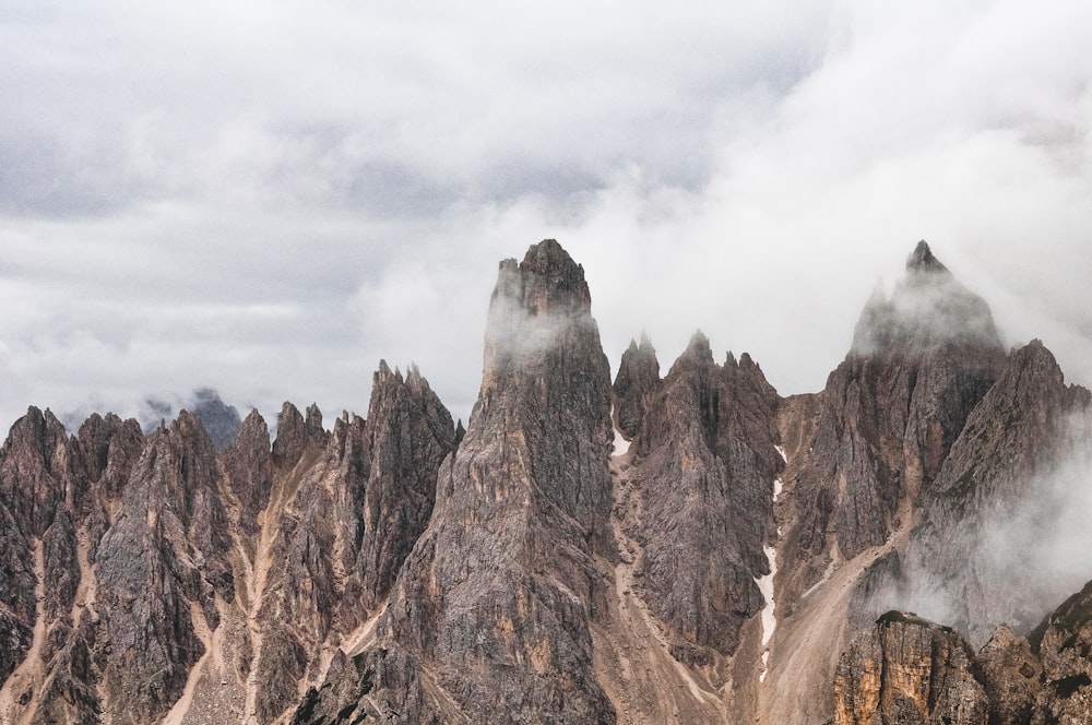 a mountain range covered in clouds and fog