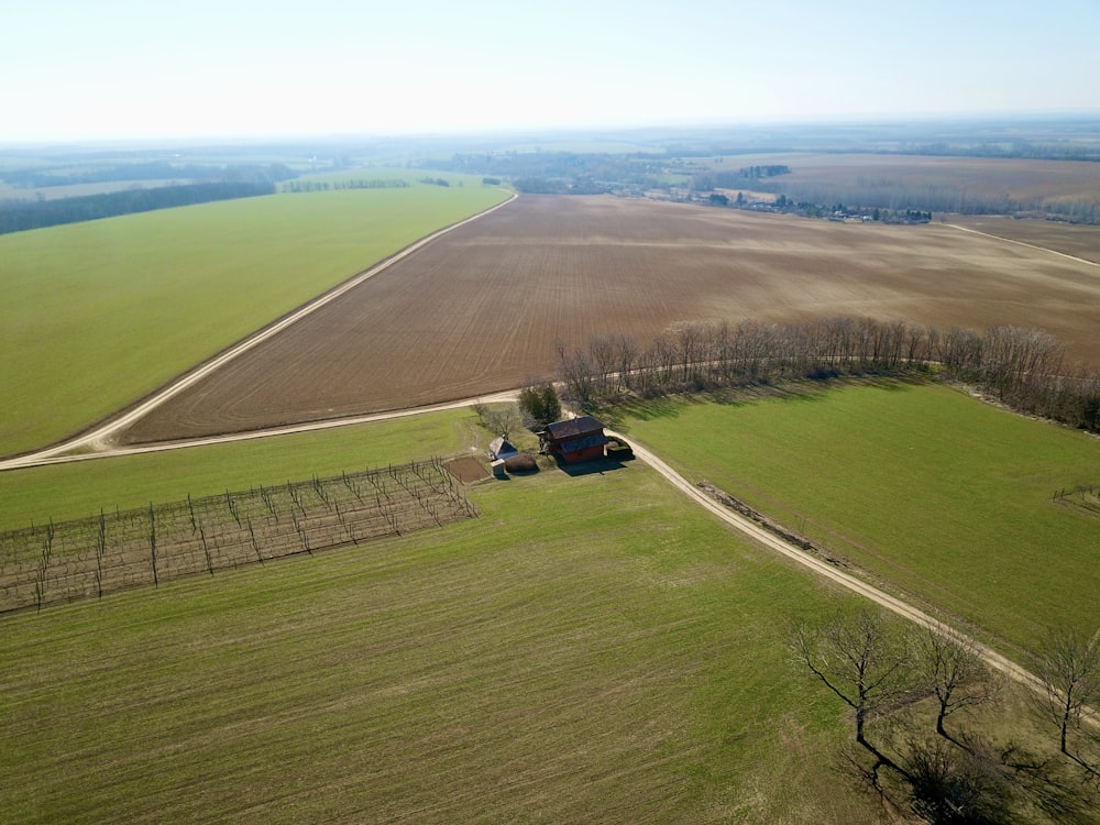 an aerial view of a farm in the middle of a field
