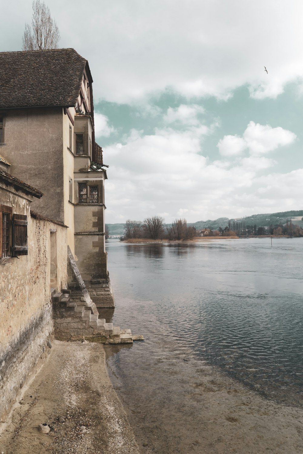 a building next to a body of water