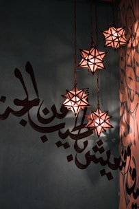 A beautifully arranged Islamic wall decor set hanging on a cozy living room wall.