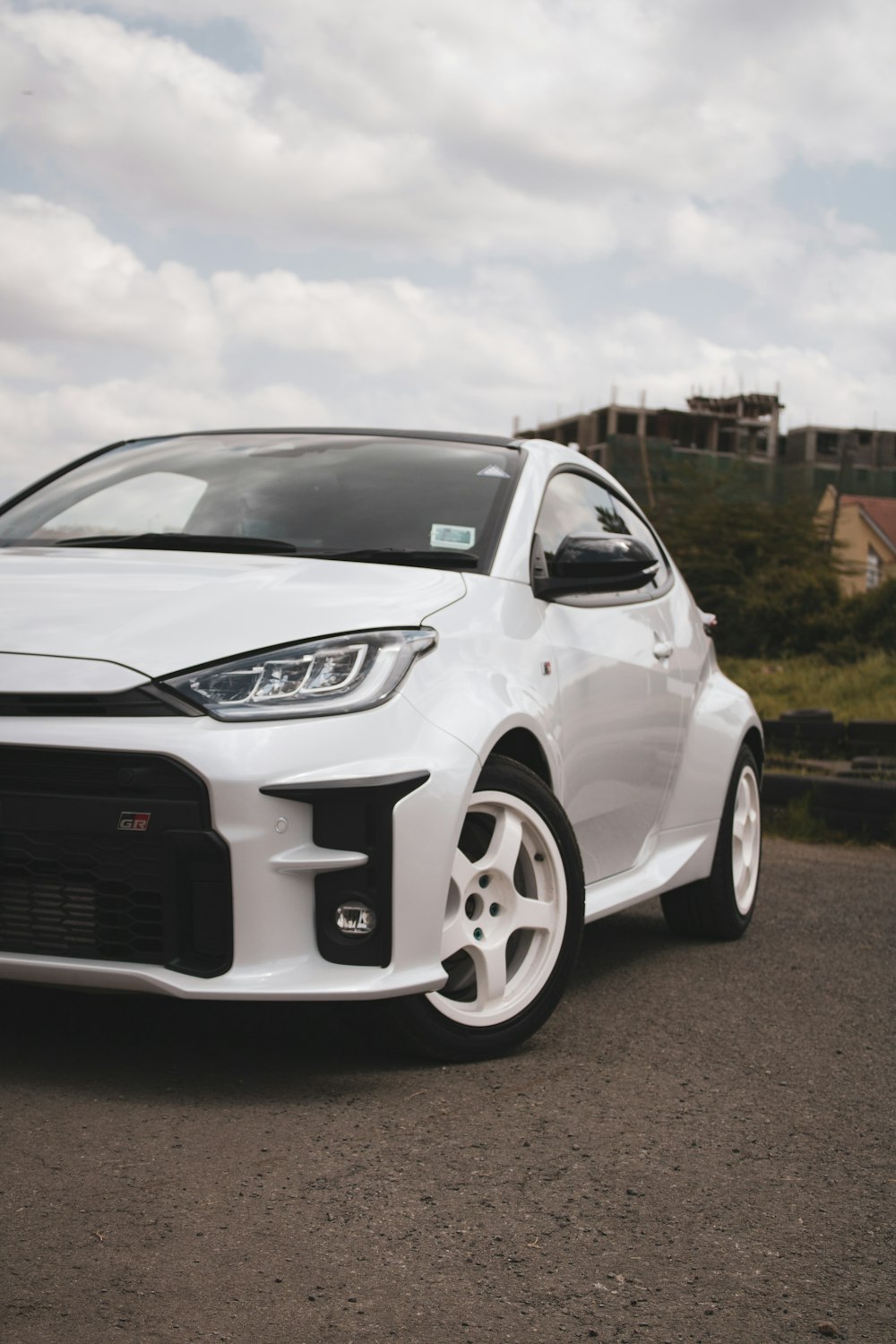 a white car parked on the side of a road