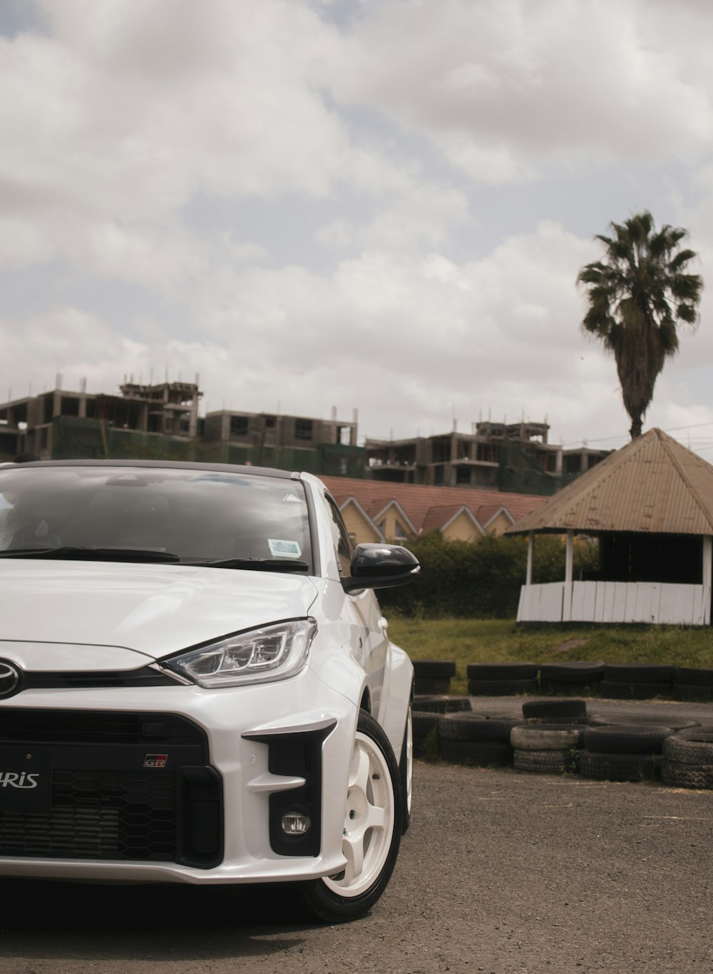 a white car parked on the side of a road