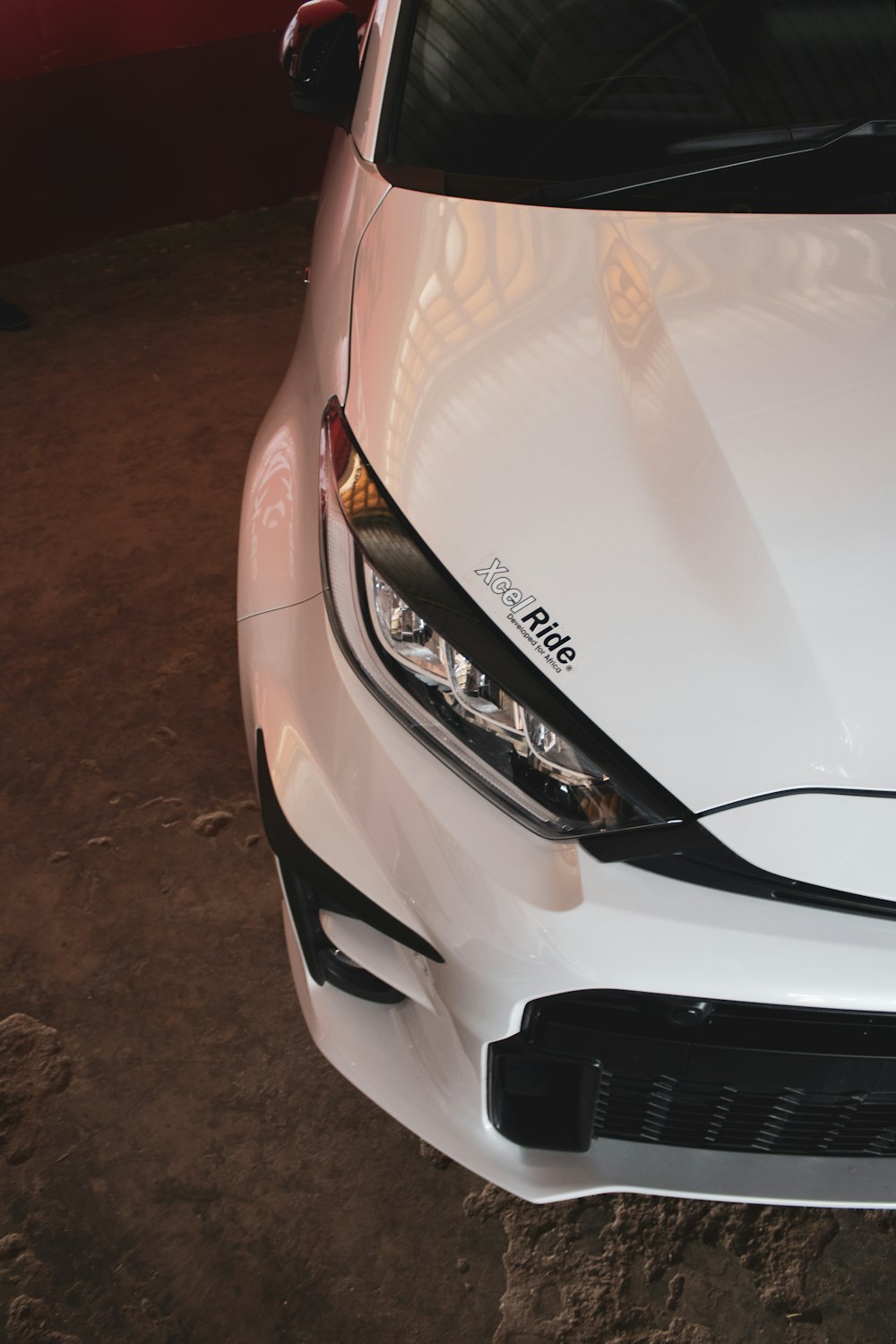 a close up of the front of a white car