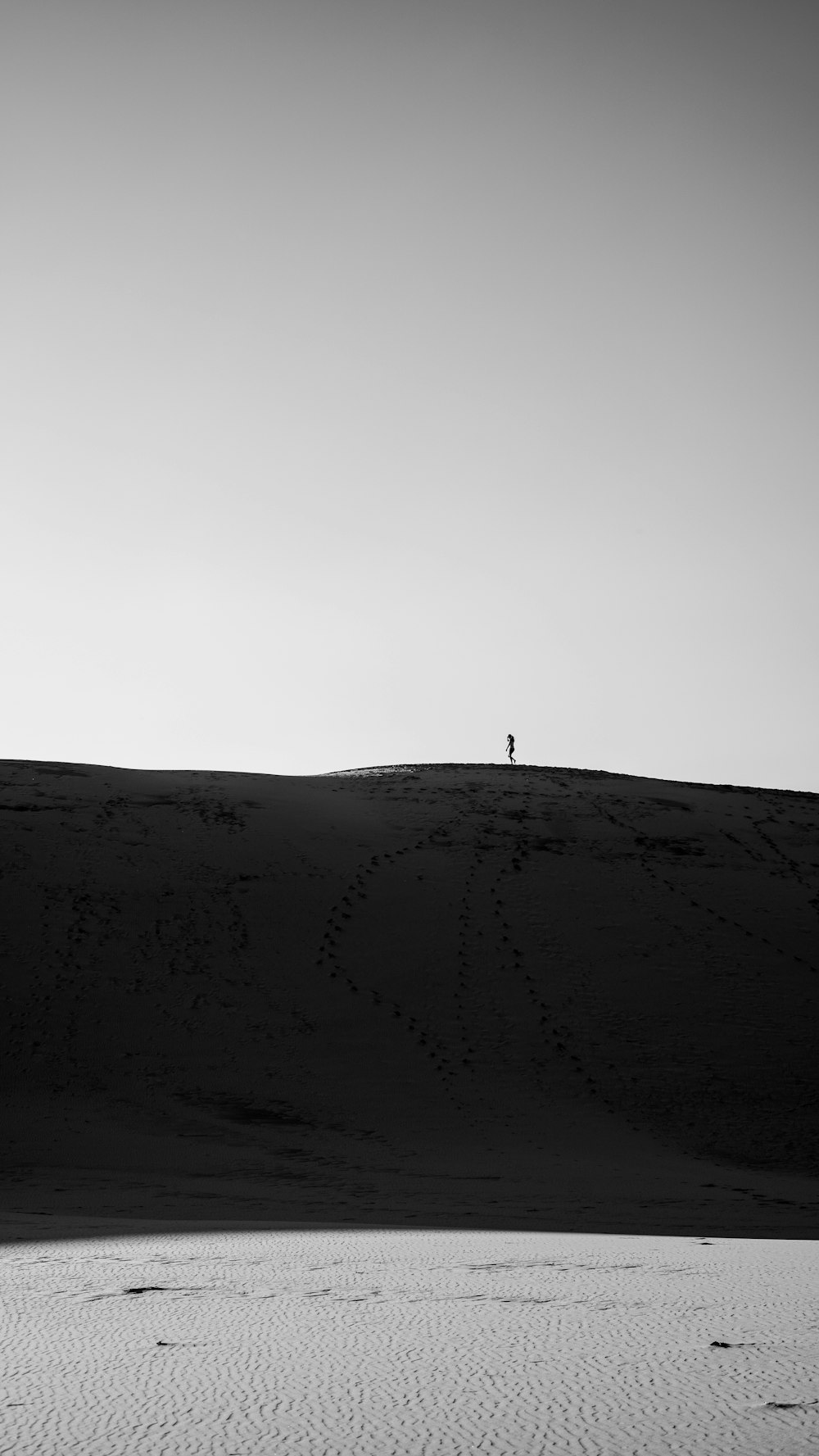 a person standing on top of a snow covered hill
