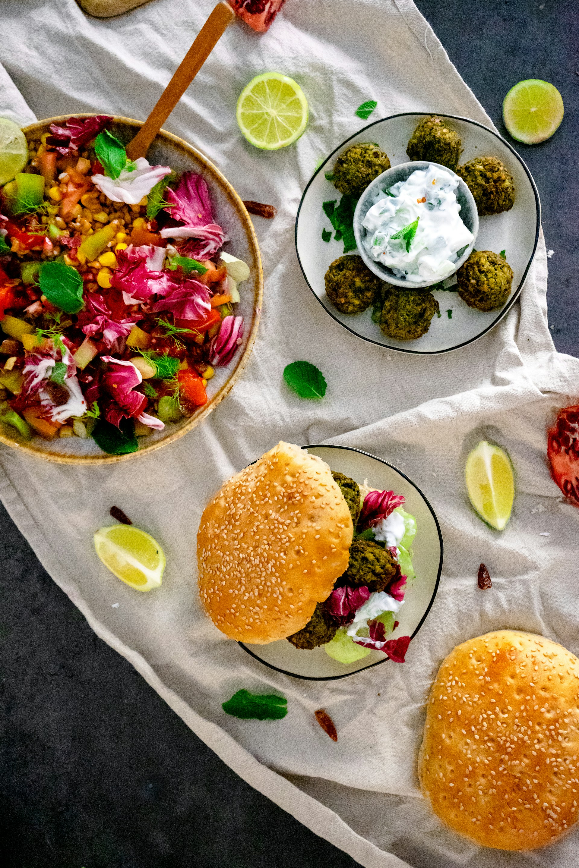 A colorful display of Pizza Planet's falafel dish alongside a side salad, highlighting the fresh ingredients and homemade sauces.