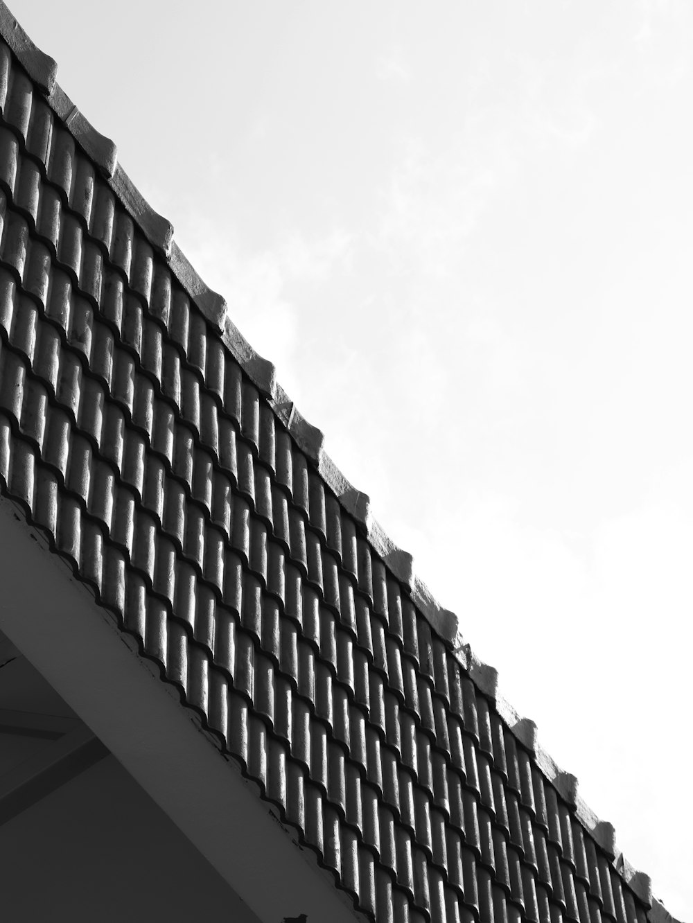 a black and white photo of a building with a clock