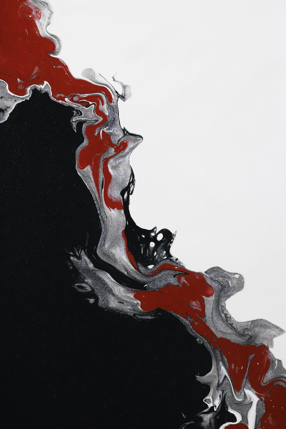 a black and red abstract painting on a white background