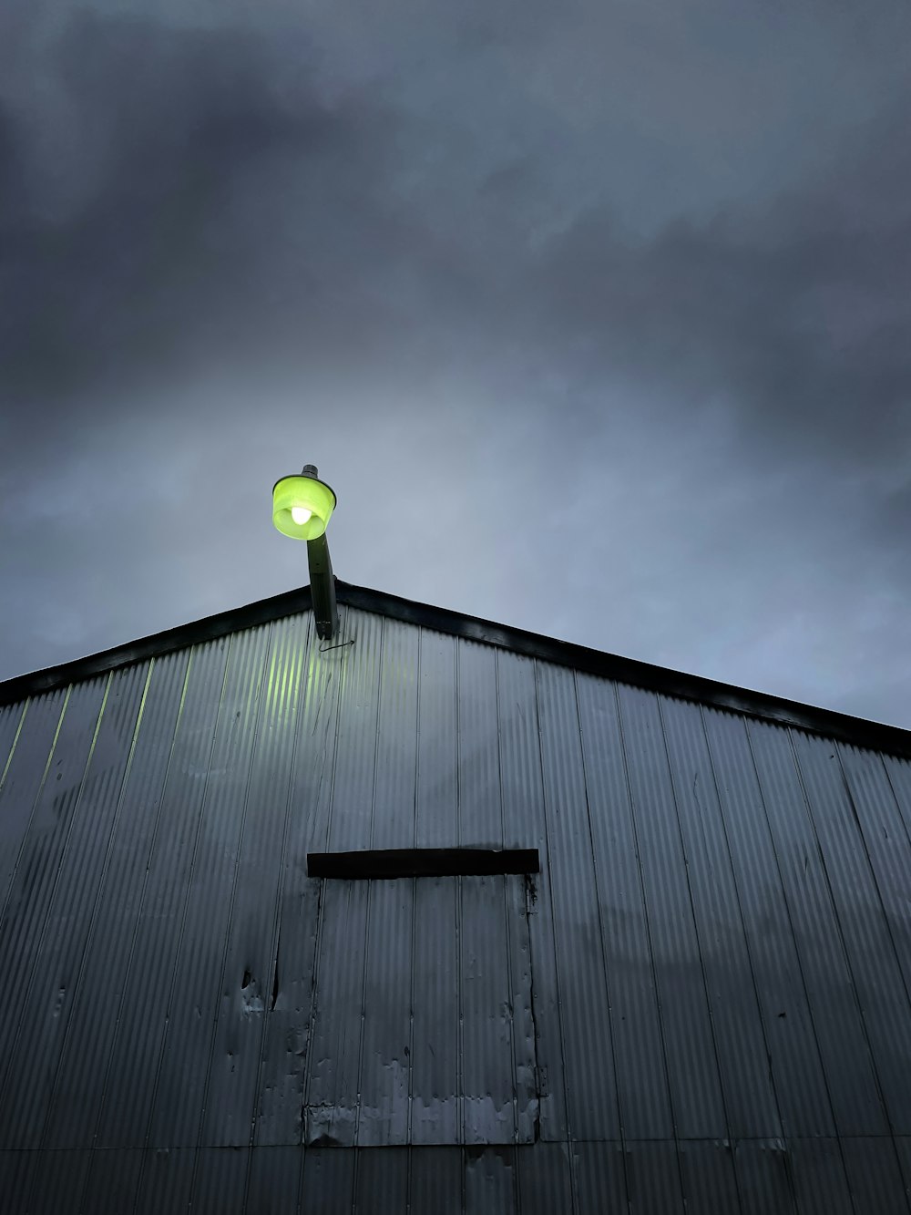 a building with a green light on top of it