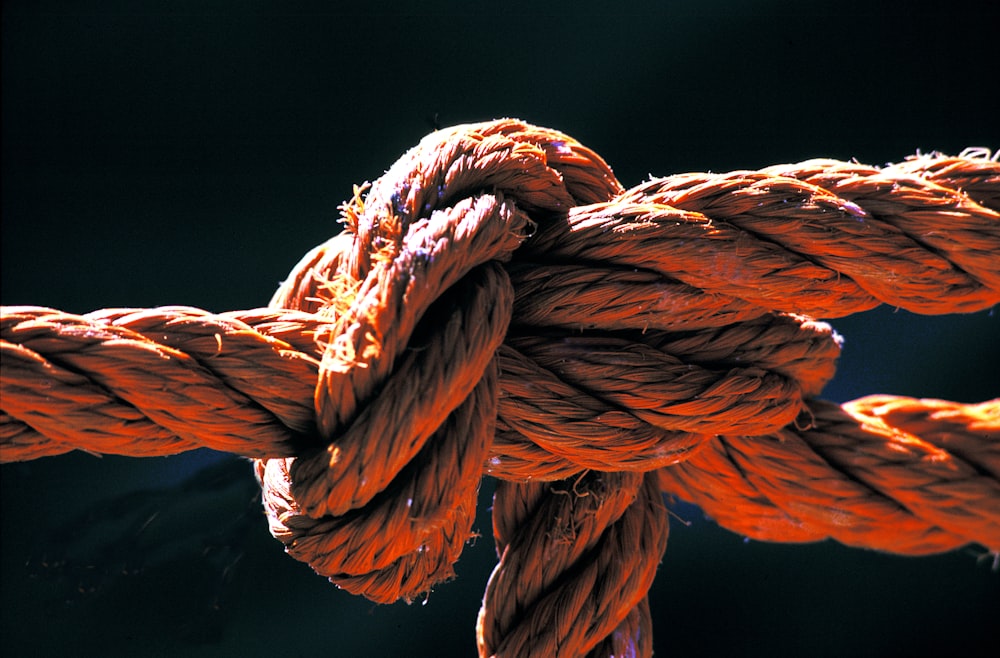 a close up of a rope with a black background