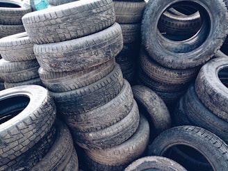 a pile of old tires stacked on top of each other