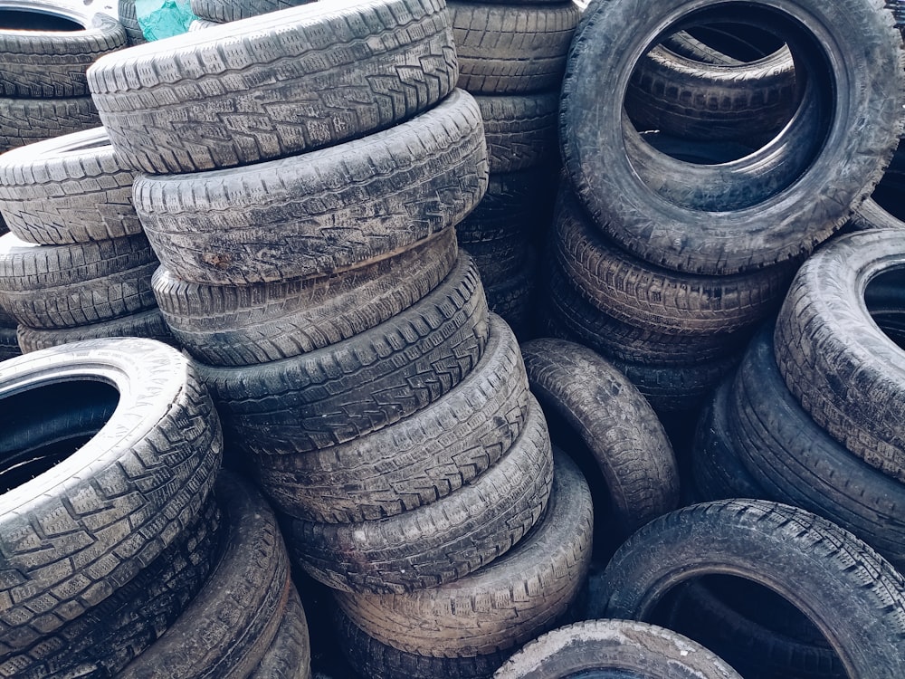 a pile of old tires stacked on top of each other