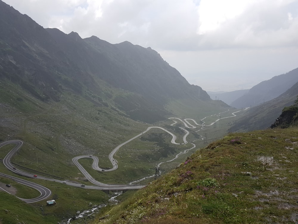 a view of a winding road in the mountains