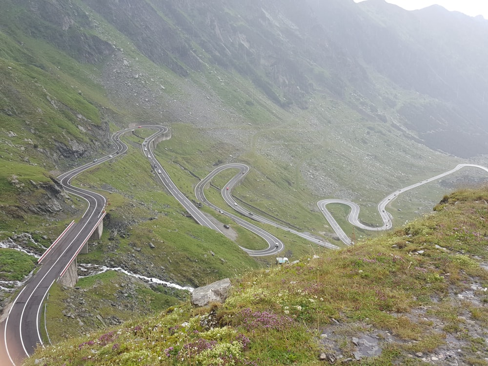 a view of a winding road in the mountains