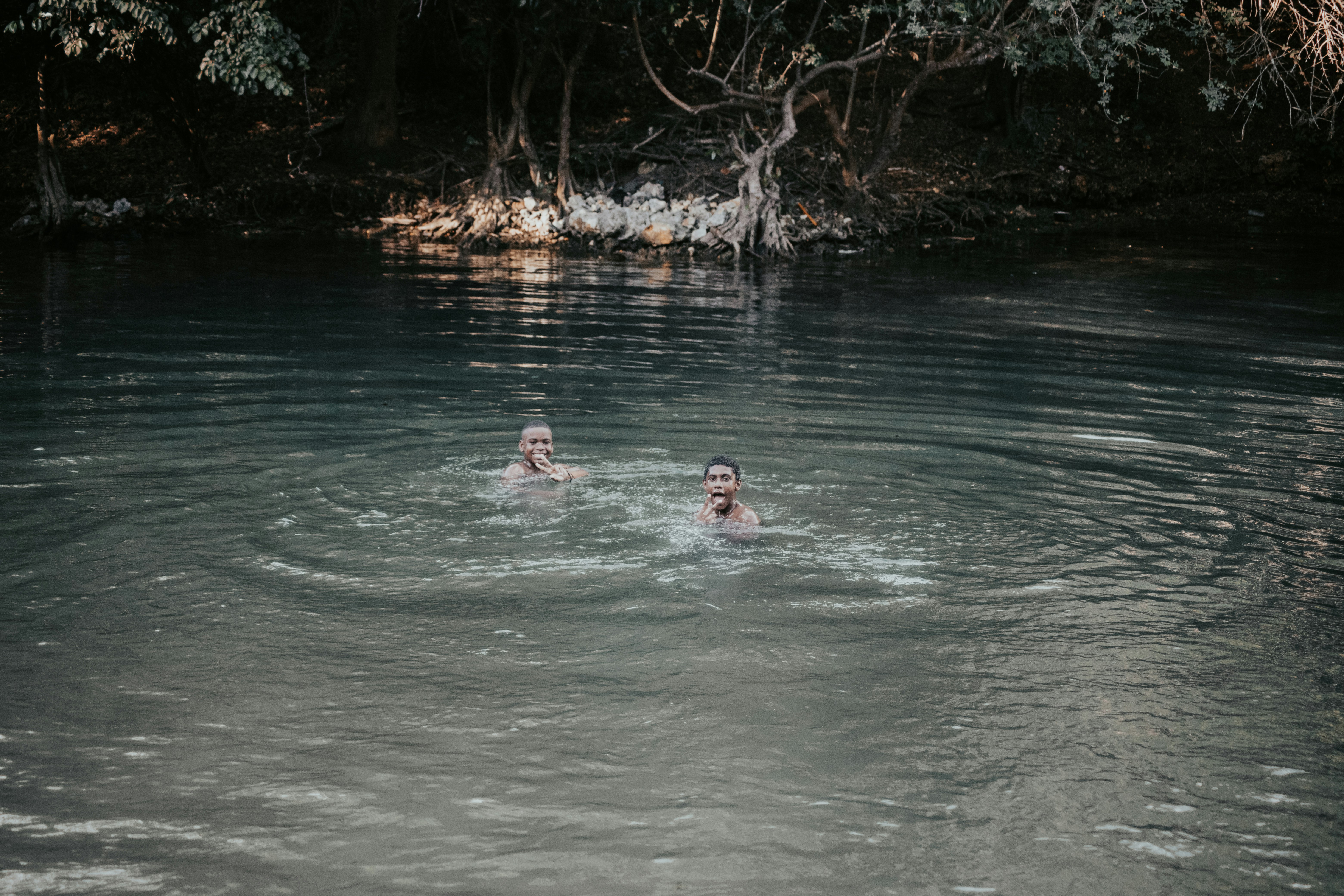 couple swimming in a cenote in Tulum - romantic getaways for couples
