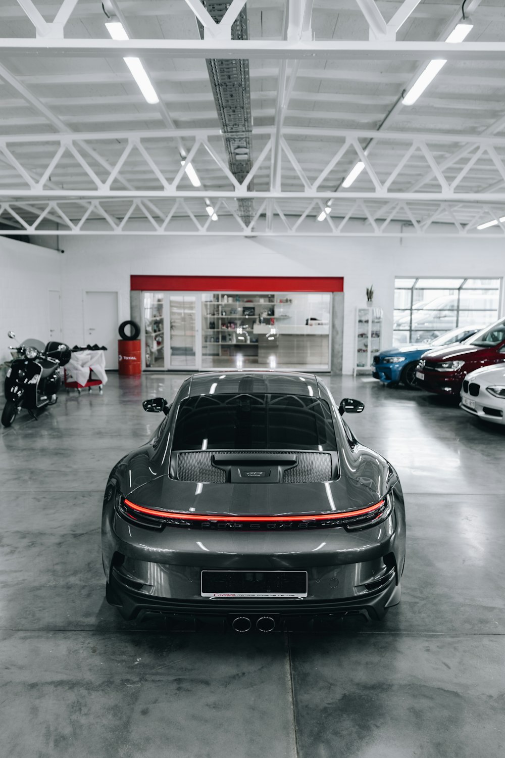a grey sports car parked in a garage