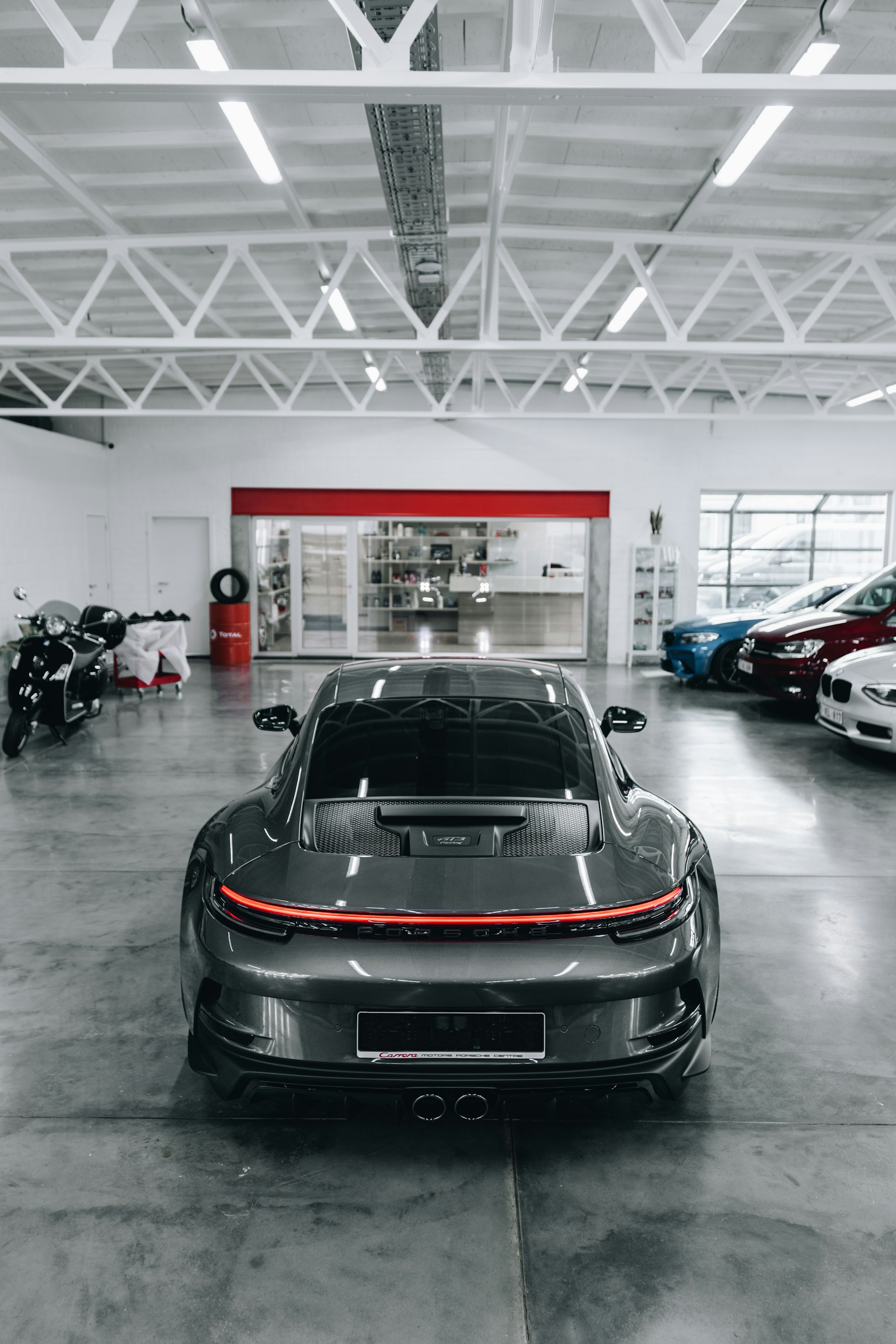 a grey sports car parked in a garage