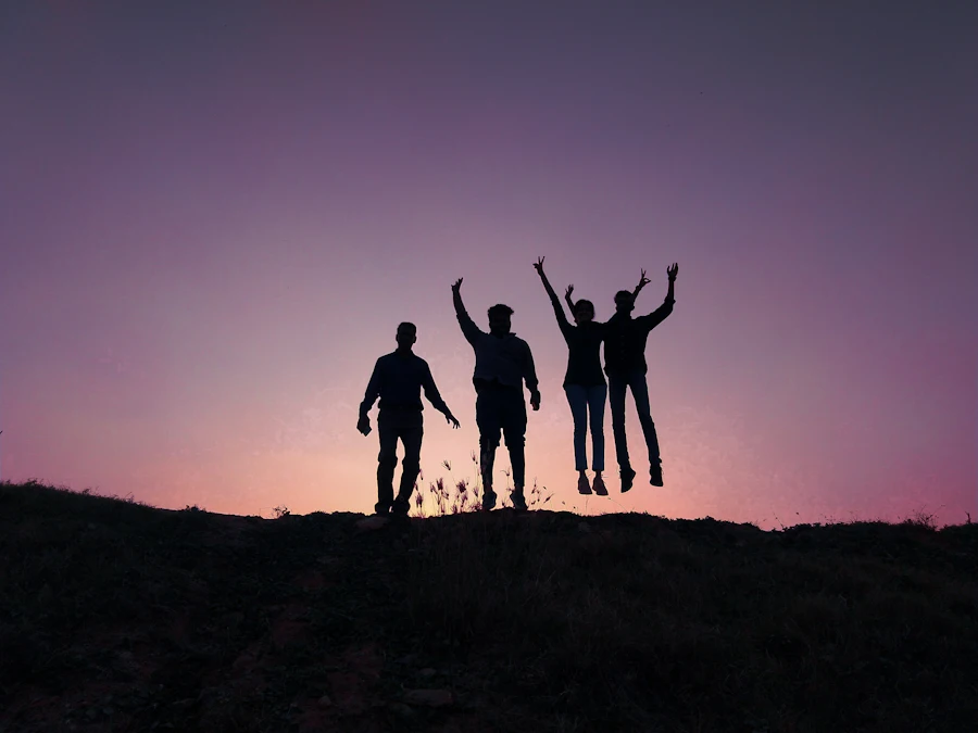 A group of people standing together on a hill