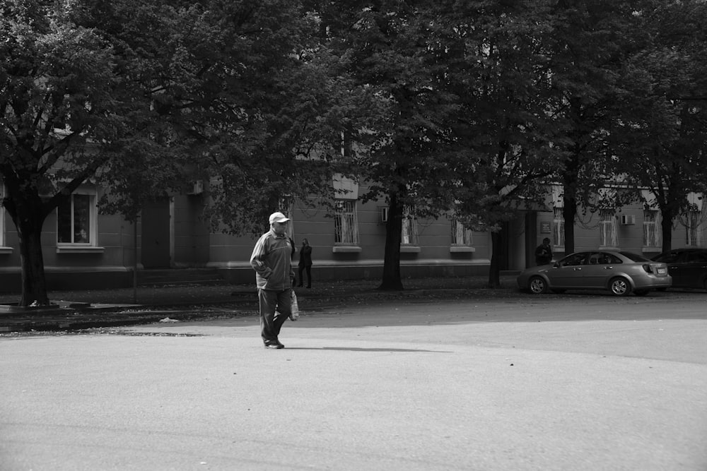 a man standing in the middle of a street