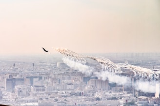 a group of airplanes flying over a city
