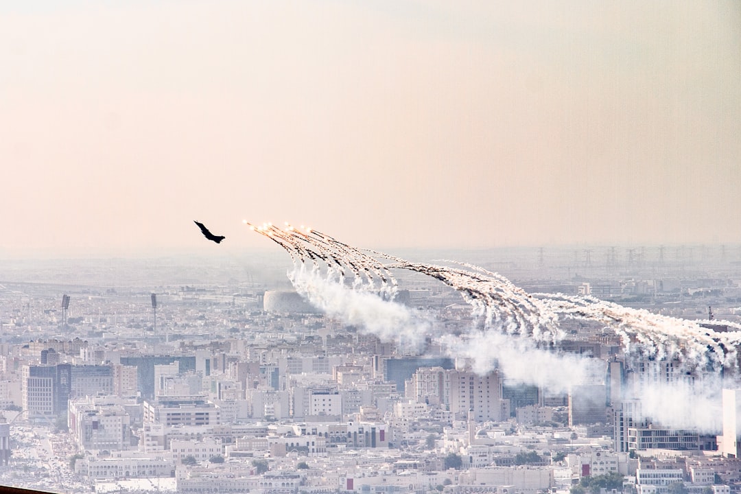 a group of airplanes flying over a city,