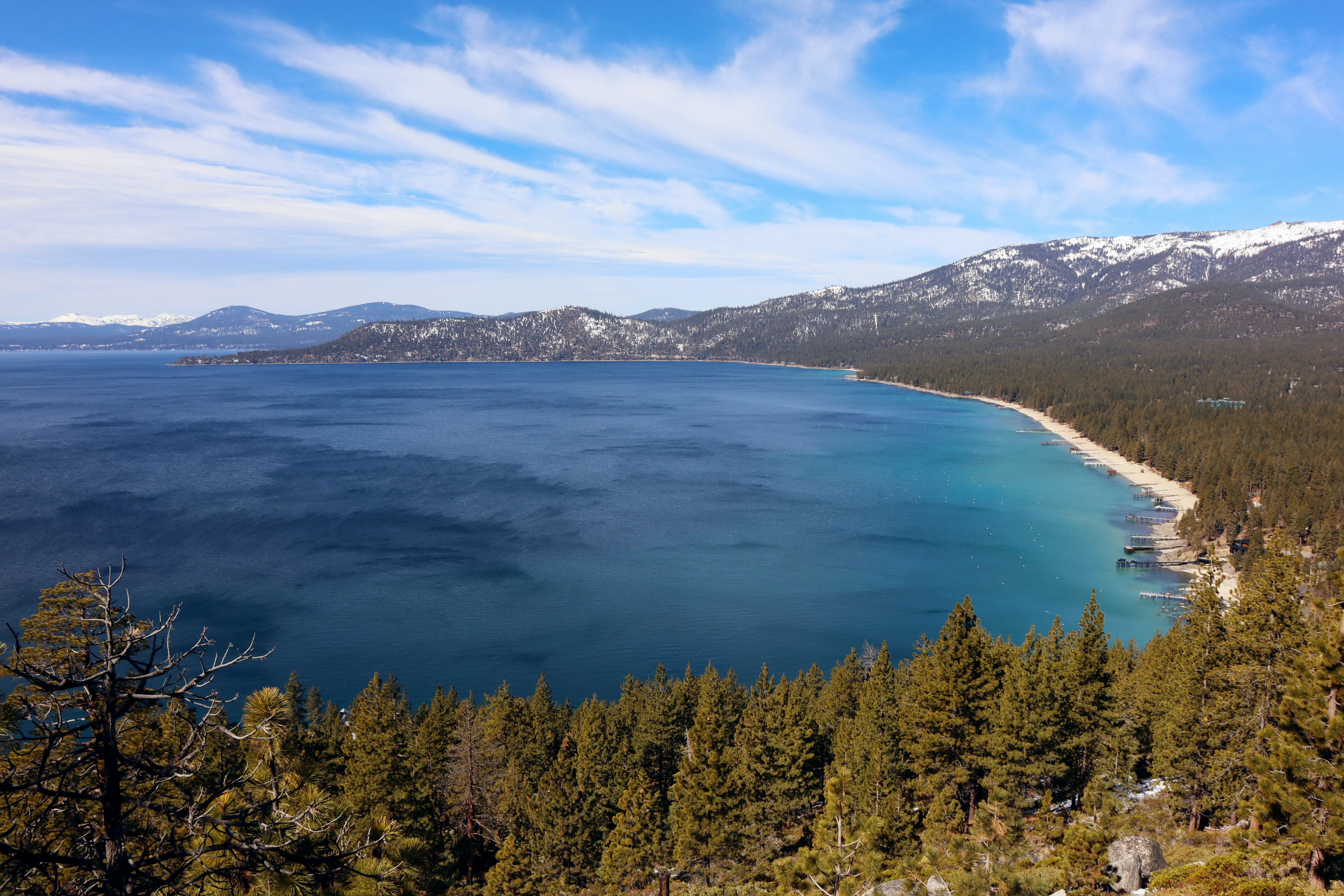 a large body of water surrounded by trees