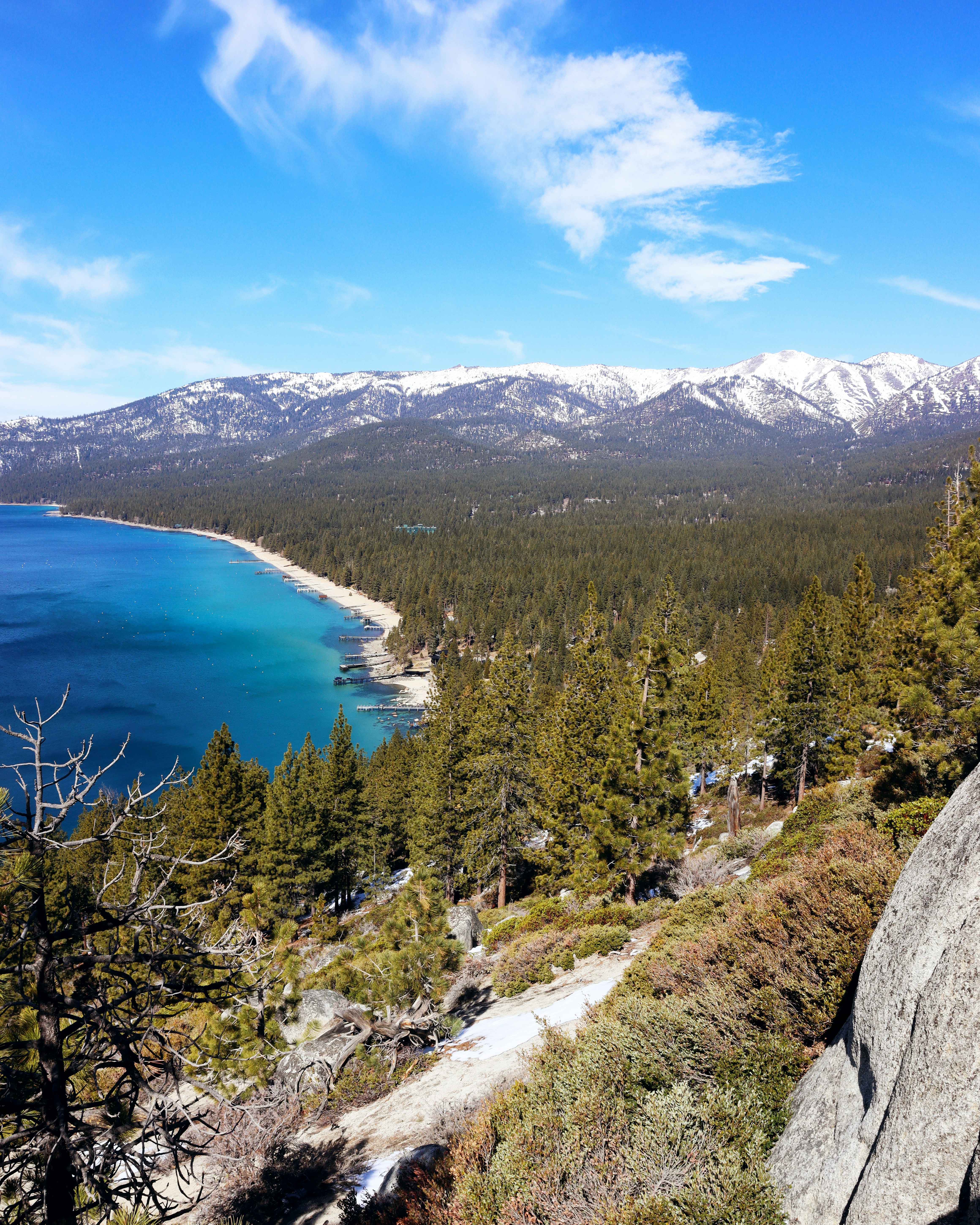 a scenic view of a lake and mountains