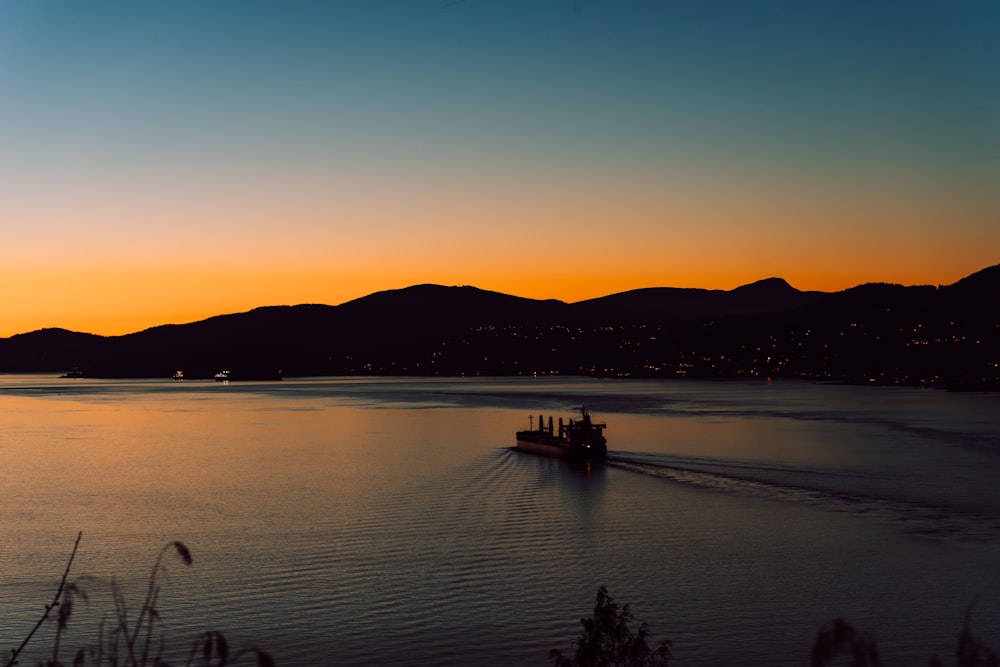 a boat traveling across a large body of water