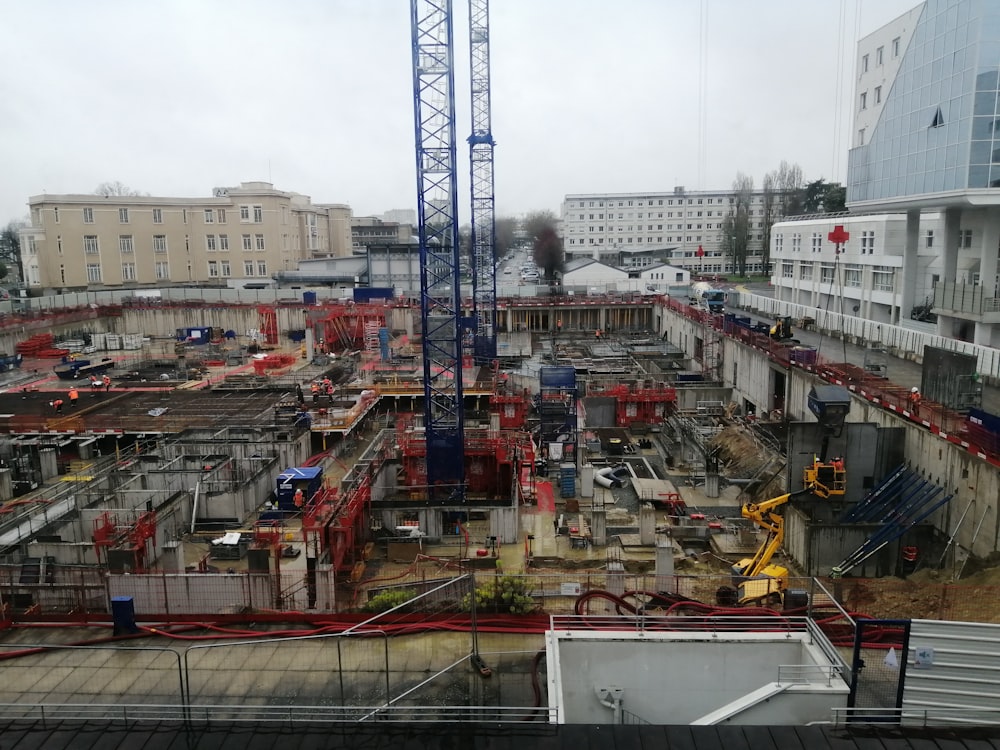 a construction site with a crane in the background