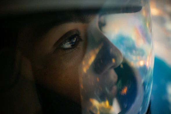a close up of a person's face with a bubble in front of them