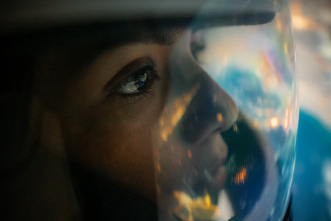 a close up of a person's face with a bubble in front of them