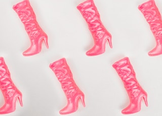 pink boots pattern on white background